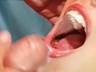 Cumshot closeup sexy babe on mouth, tongue, lips dripping on tits
