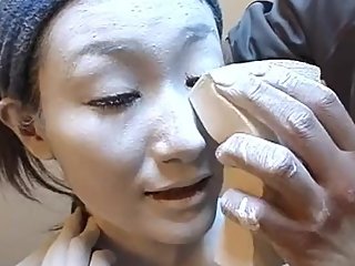 Apply Geisha white foundation to entire body and dress up as office lady