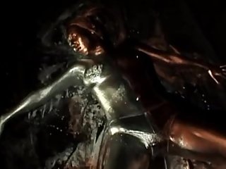 Girl merging with black background and reappear by silver/gold paint